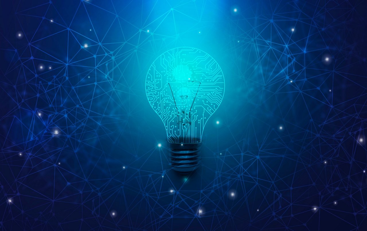 Glowing blue lightbulb with circuit-board patterns surrounded by an interconnected digital network.