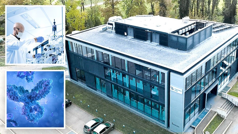 Modern research facility with a scientist in a lab and an inset illustration of an antibody.