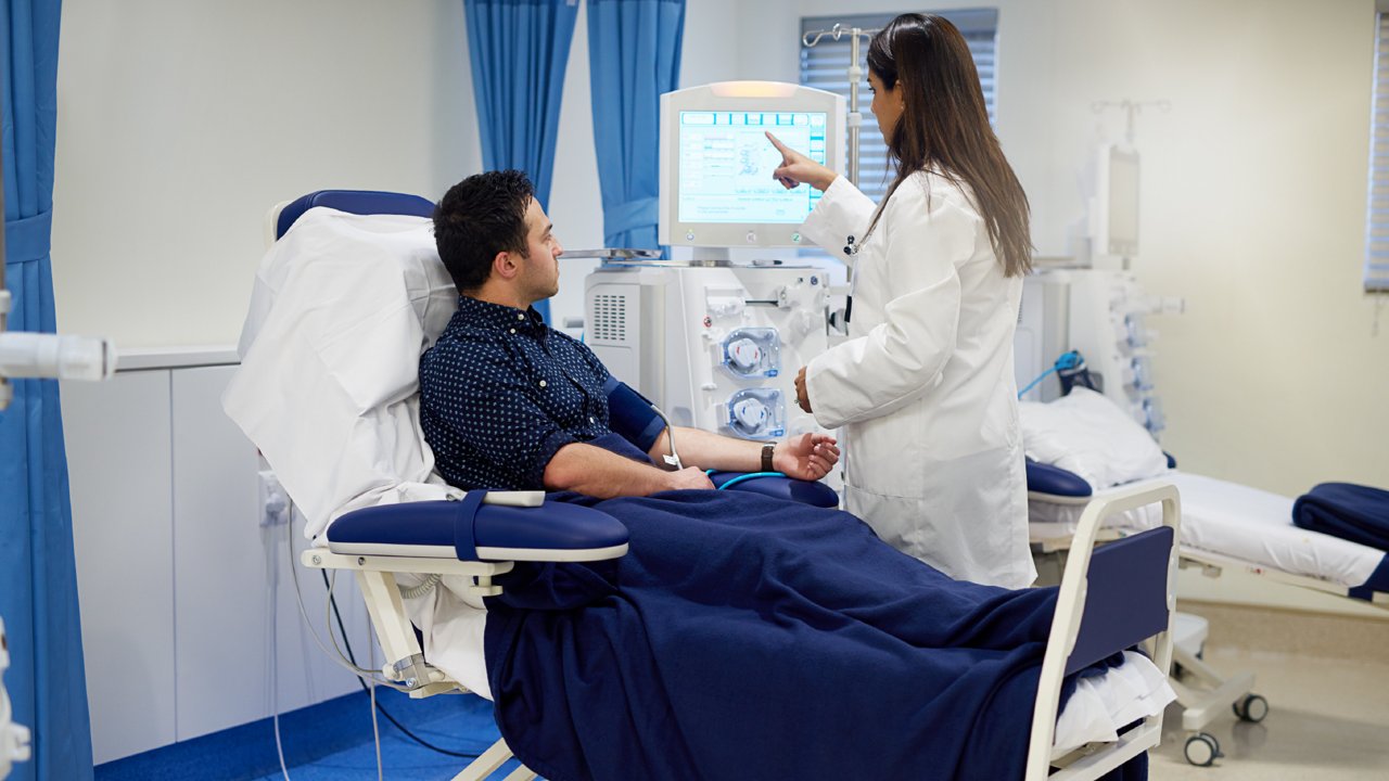 patient with dialysis and nurs in hospital bed
