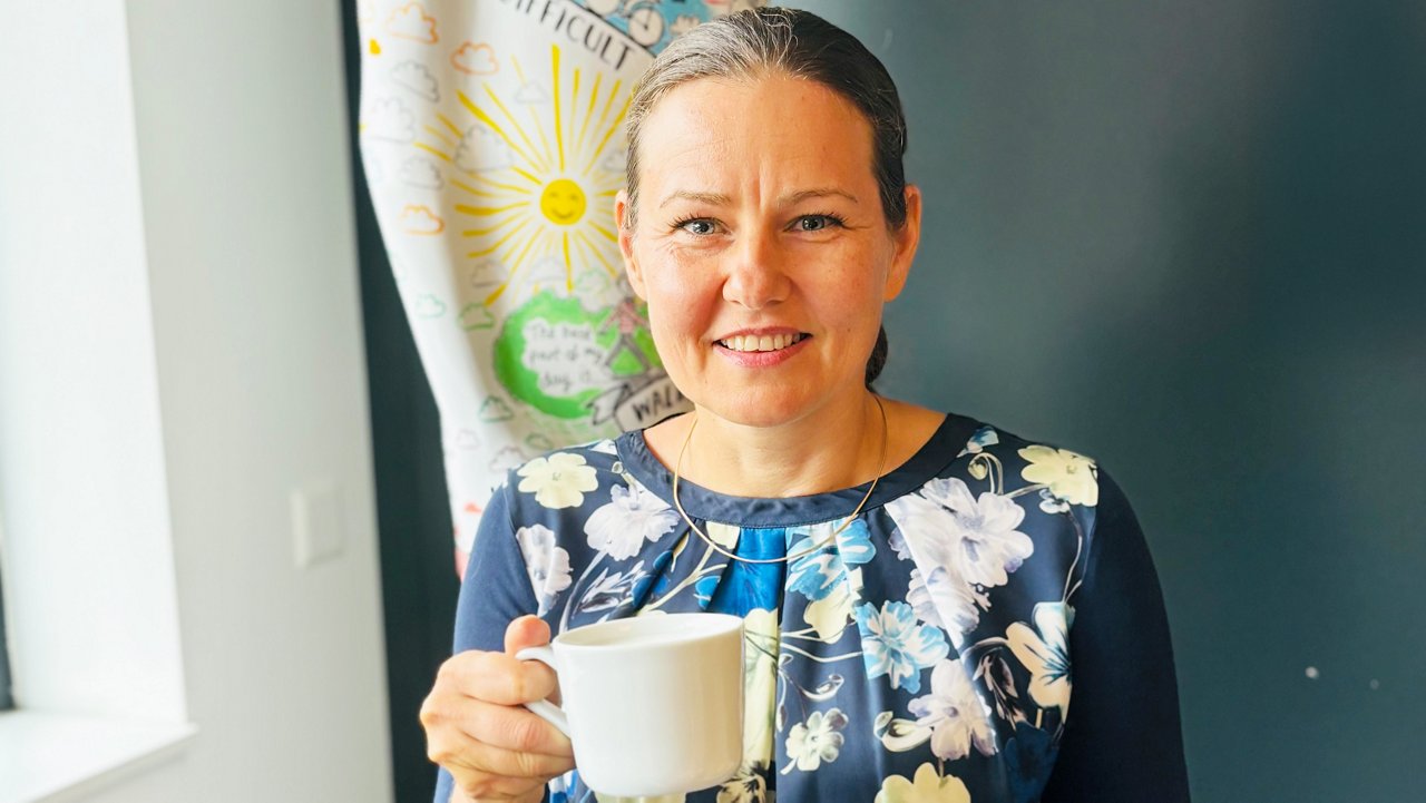 Ivett Jelinek enjoying coffee during an interview at Fresenius Kabi SwissBioSim