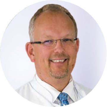 Portrait picture of Prof. Bernd Reith smiling. 