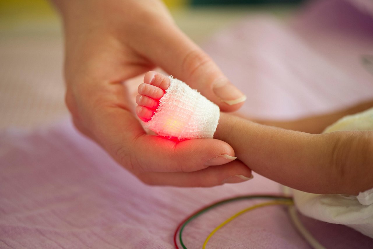 Preterm infant with pulse oximeter