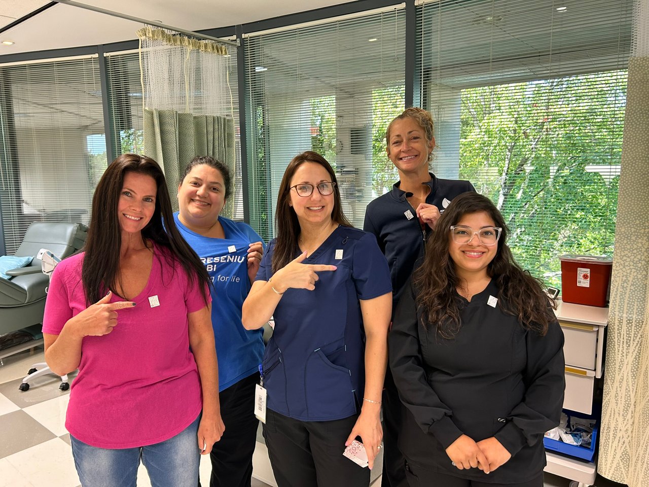 Fresenius Kabi employees wearing their 2025 Blood Collectors Week pins