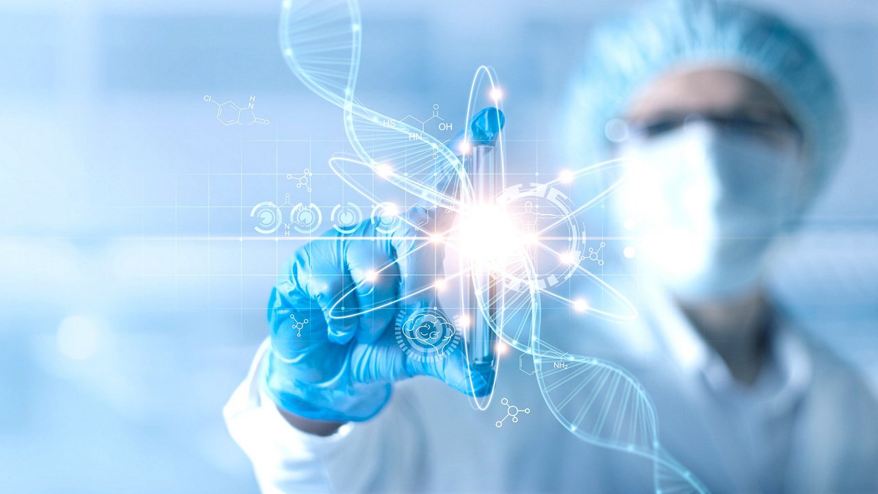 Scientist in protective gear touches a glowing DNA helix hologram with a gloved hand.