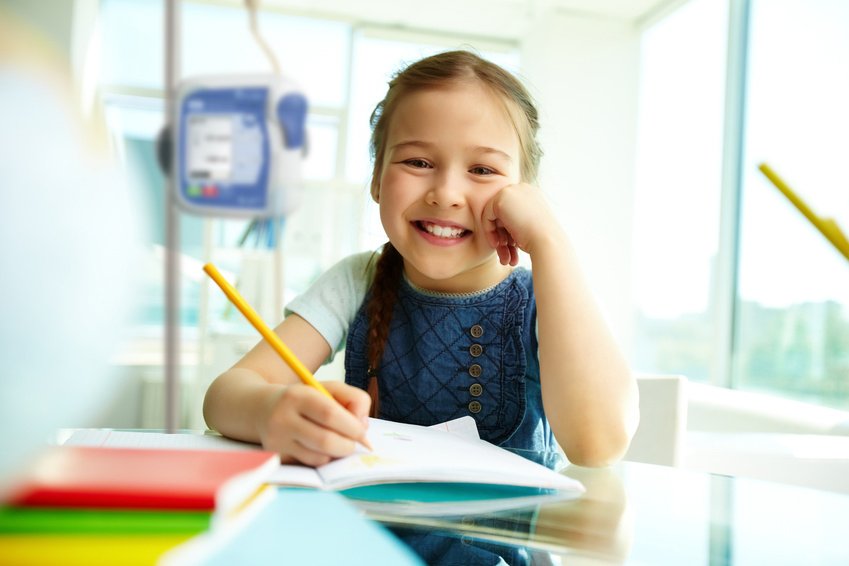 Portrait of lovely girl looking at camera with smile