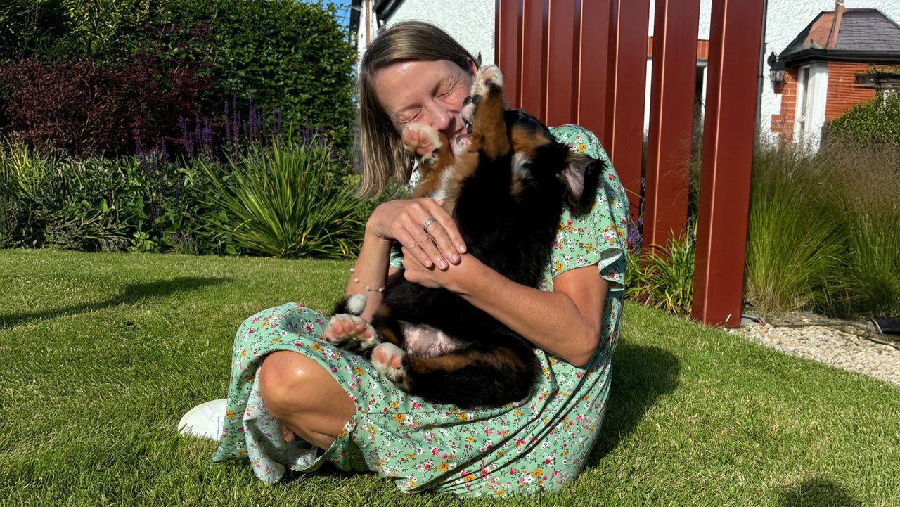 deborah and her dog in the garden