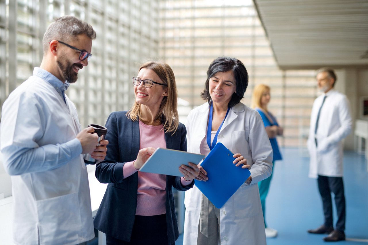 Healthcare professionals talking to a sales team member