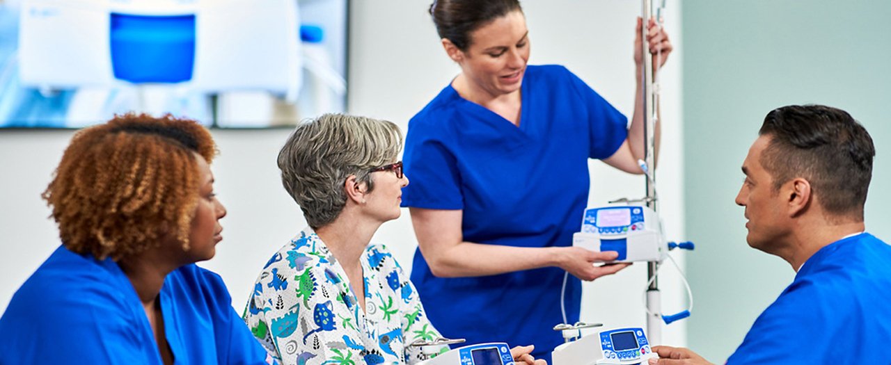 nurses and doctor talking