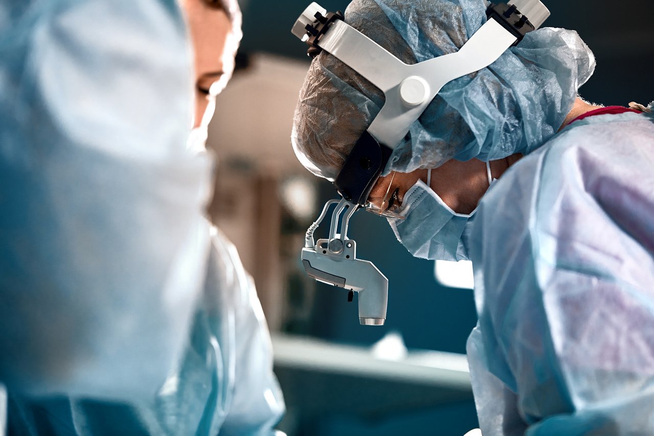 female doctor touching shoulder of patient