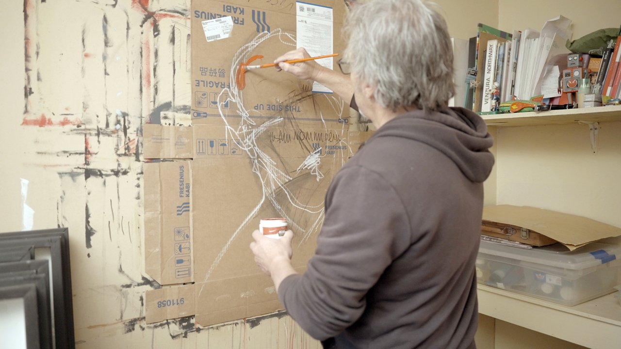 Marco Ubeda is painting on cardboard inspired by his son’s medical journey