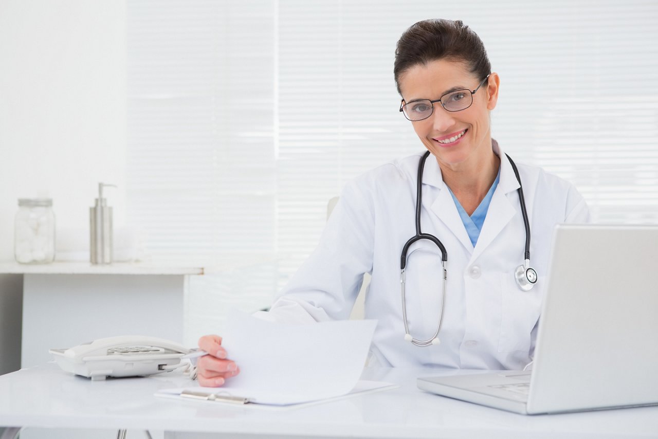 Doctor looking at clipboard in medical office; Shutterstock ID 255854374; po: 2251100 (Christina Günther); job: Marketingkommunikation; client: Fresenius Kabi Deutschland GmbH; other: Sonja Eilbert für Estelle Boché