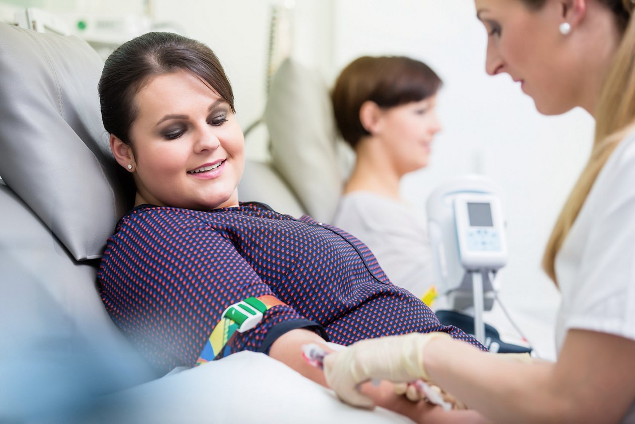 woman donates blood