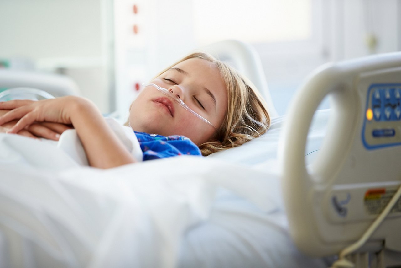 young girl sleeping in intensive care unit